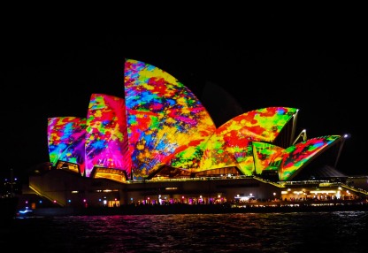 The iconic Opera House bathed in a laser show.